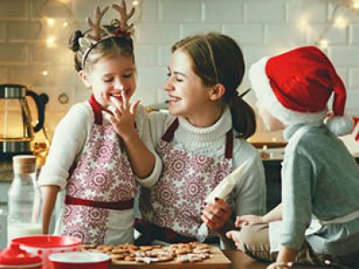 happy funny family mother and children  bake christmas cookies