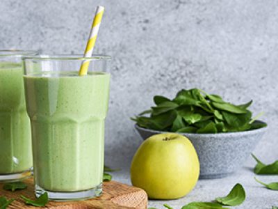 Green vegan smoothie. Smoothie with apple, banana and avocado. Detox menu